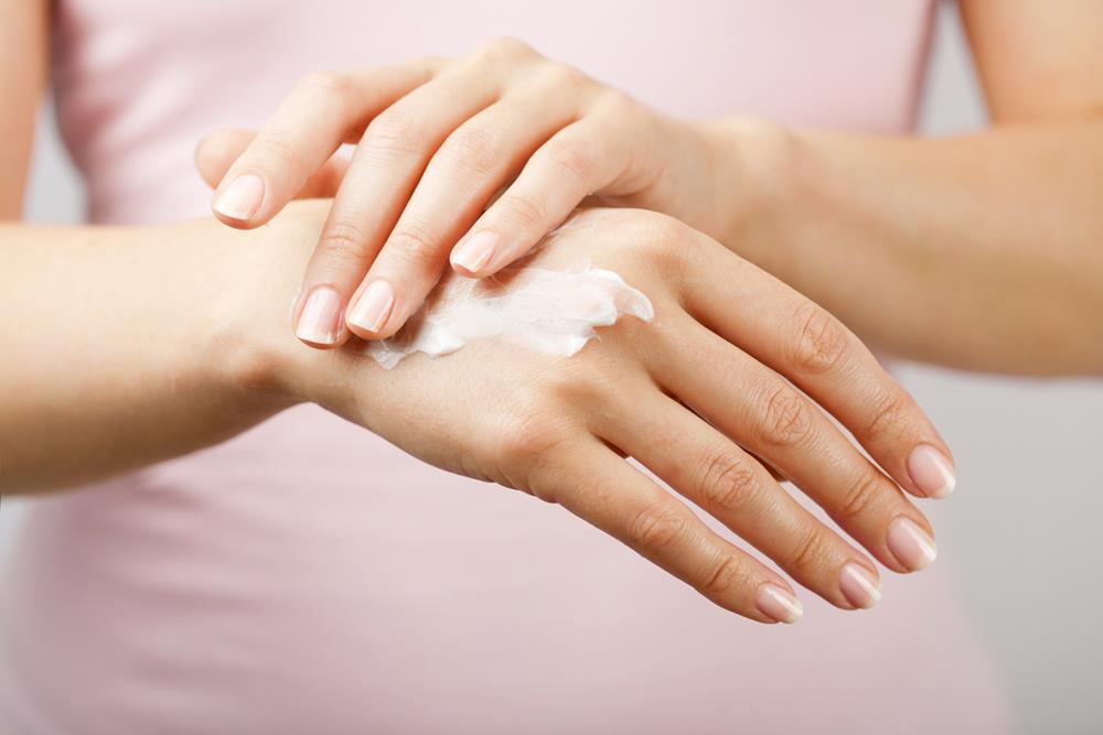 Woman’s hands with cream